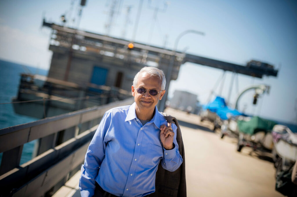 Ramanathan outside on pier. Photo: Scripps Institution of Oceanography, UC San Diego